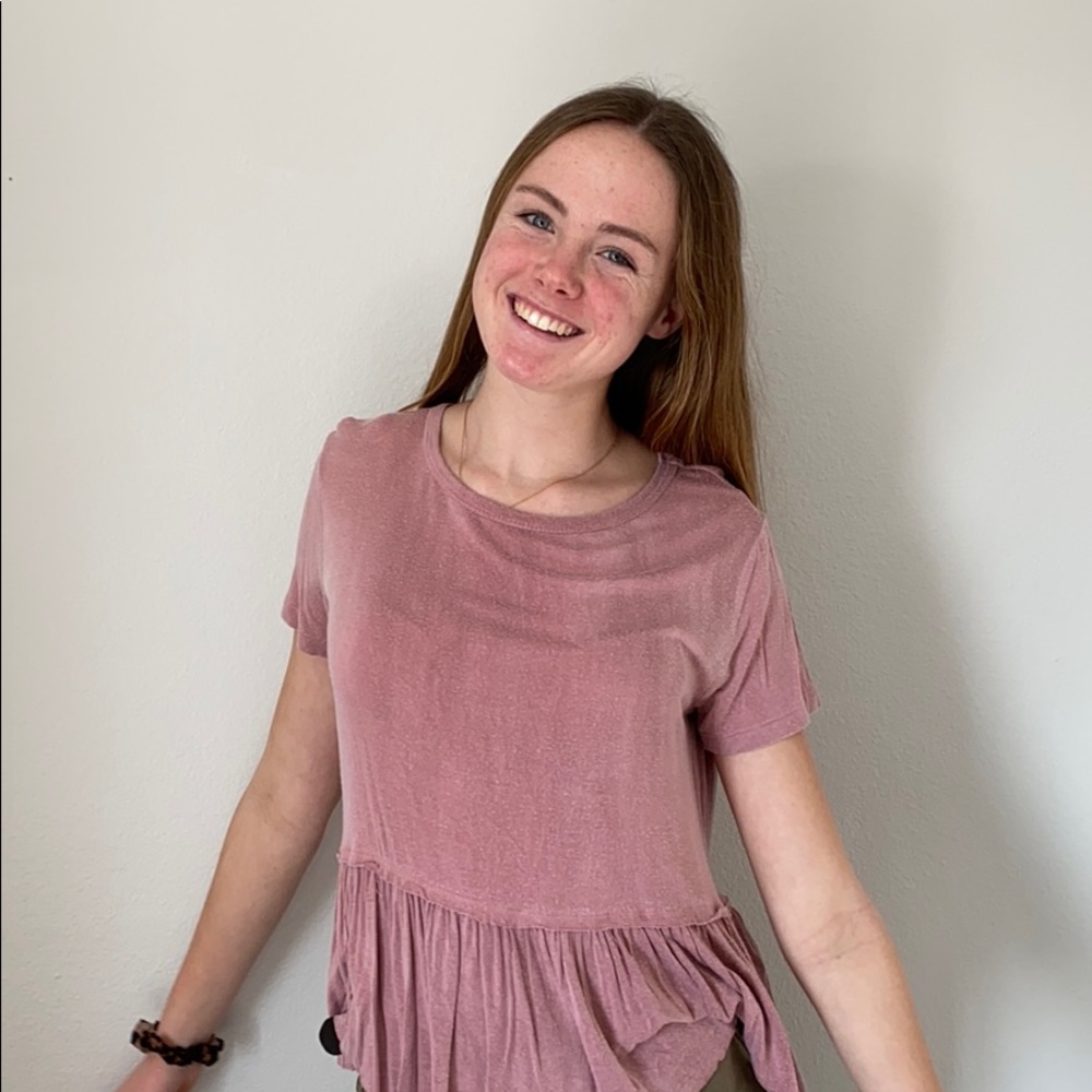 Pink flowy top with ruffles at end